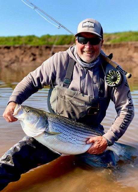 A man holding a fish.